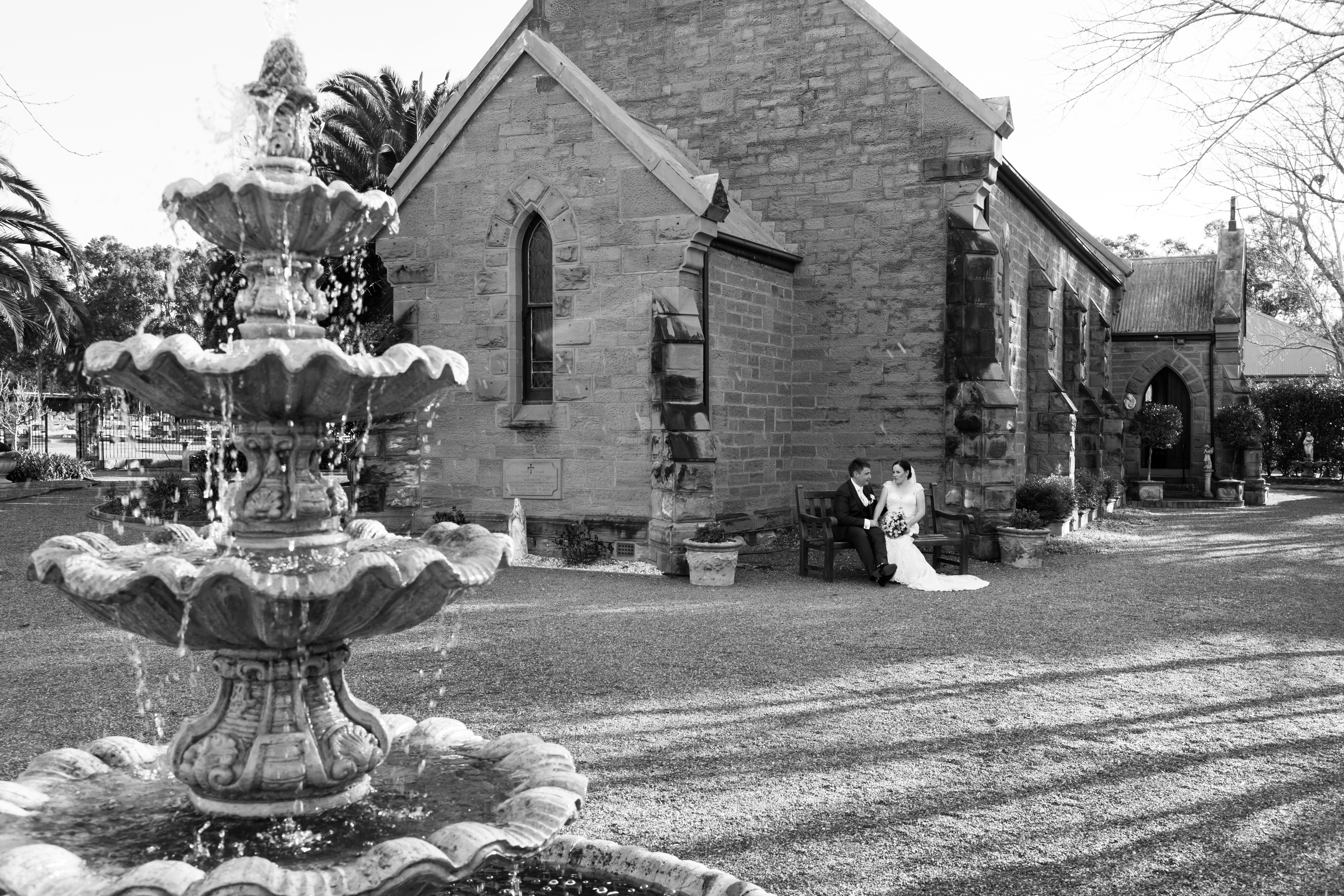 couple sitting in front of a church